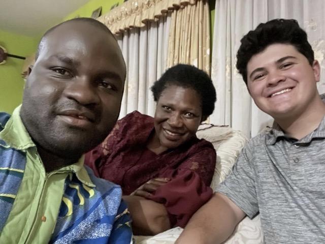 Mama Rosemary, her son and Ben Ross at their home in Kitengela.